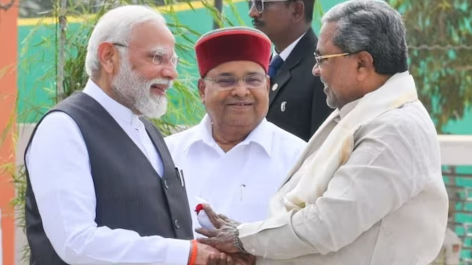 PM Modi : मोदी-मोदी के नारे लगने पर पीएम मोदी ने ली कर्नाटक के सीएम सिद्धारमैया की चुटकी